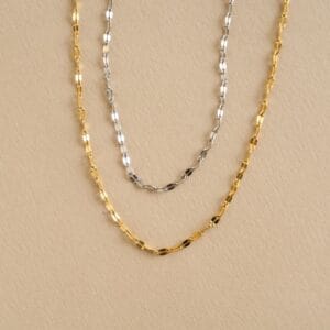 deux collier en inox argenté et doré