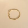 bracelet doré en acier en forme de corde