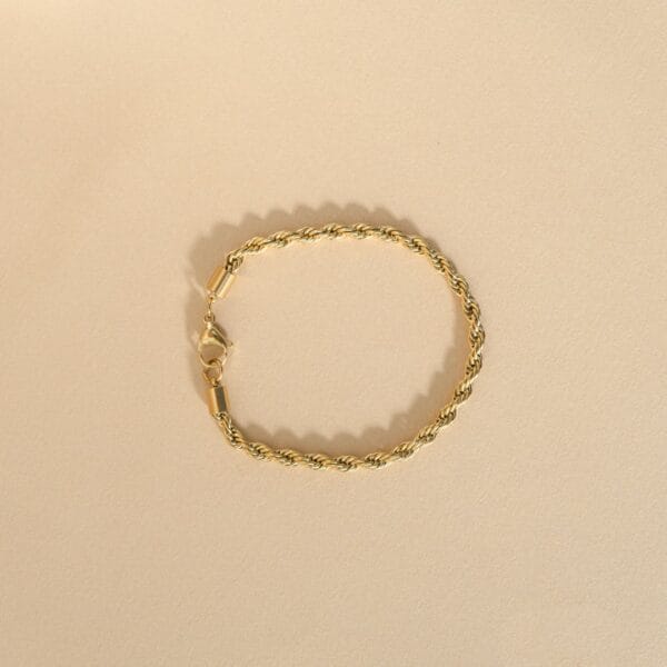 bracelet doré en acier en forme de corde